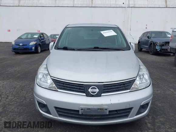2009 Nissan Versa 1.8 SL with VIN 3N1BC13E19L500653, listed as a IAAI auction lot 41616544 with 138,554 mi miles. Bid and sale history available at carsss.com. Image 6.