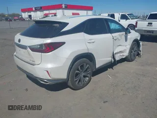 2018 Lexus RX 350 z VIN 2T2BZMCAXJC144930, wystawiony jako IAAI lot #41857778 z przebiegiem 108 191 mil mil oraz . Historia ofert i sprzedaży dostępna na DreamBid. Obrazek 4.