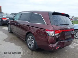 2014 Honda Odyssey Touring with VIN 5FNRL5H9XEB073156, listed as a IAAI auction lot 41990714 with 166,129 mi miles and . Bid and sale history available at DreamBid. Image 3.