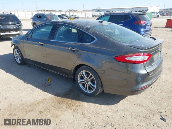 2016 Ford Fusion Titanium Hybrid с VIN 3FA6P0RU8GR266488, выставлен на аукционе IAAI как лот 41903919 с пробегом 74 927 миль миль и . История ставок и продаж доступна на DreamBid. Изображение 3.