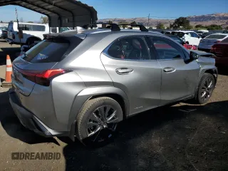 2022 Lexus UX 250h F Sport with VIN JTHE9JBH2N2062143, listed as a Copart auction lot 77345634 with 13,118 mi miles and Salvage Title. Bid and sale history available at DreamBid. Image 3.