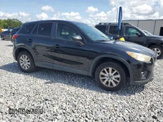 2014 Mazda CX-5 Touring z VIN JM3KE2CY8E0326988, wystawiony jako Copart lot #60473715 z przebiegiem 231 055 mil mil oraz Czysty tytuł • Clean title. Historia ofert i sprzedaży dostępna na DreamBid. Obrazek 4.