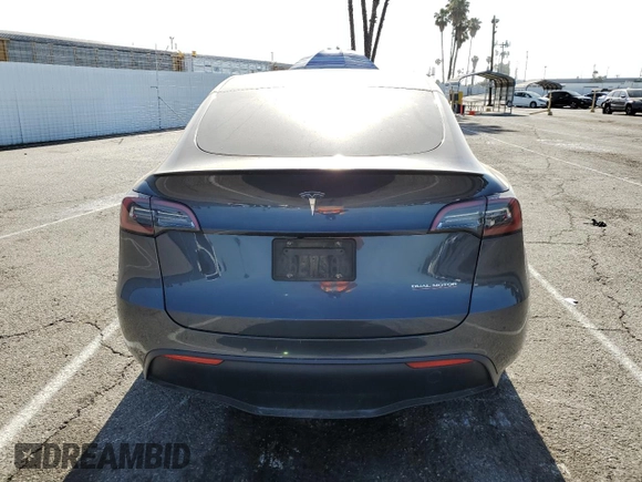 2022 Tesla Model Y Performance z VIN 7SAYGDEF1NF405329, wystawiony jako Copart lot #57249195 z przebiegiem 62 423 mil mil oraz Szkoda całkowita • Salvage title. Historia ofert i sprzedaży dostępna na DreamBid. Obrazek 6.