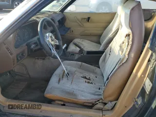 1981 Datsun 280ZX z VIN JN1HZ04S8BX265704, wystawiony jako Copart lot #71597844 z przebiegiem 251 218 mil mil oraz Tytuł czysty. Historia ofert i sprzedaży dostępna na DreamBid. Obrazek 7.
