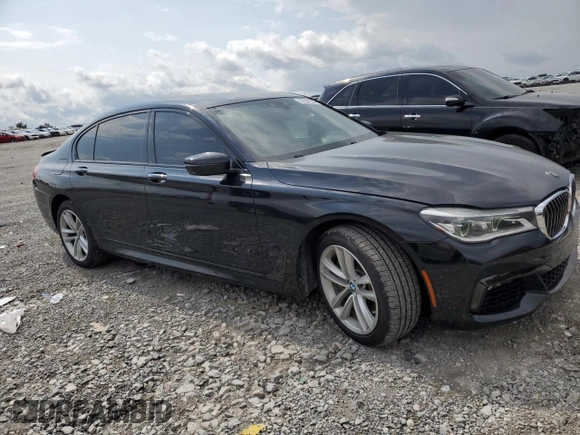 2016 BMW 7 Series 750i with VIN WBA7F0C53GGM20760, listed as a Copart auction lot 57230334 with 77,588 mi miles and Salvage Title. Bid and sale history available at carsss.com. Image 4.