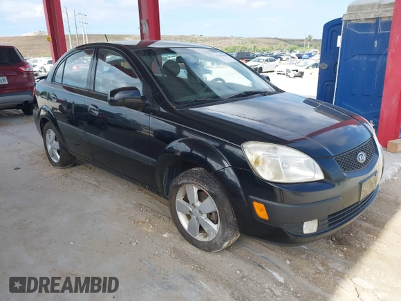 2009 Kia Rio LX with VIN KNADE223496561265, listed as a IAAI auction lot 42143889 with 235,634 mi miles and . Bid and sale history available at DreamBid. Image 1.