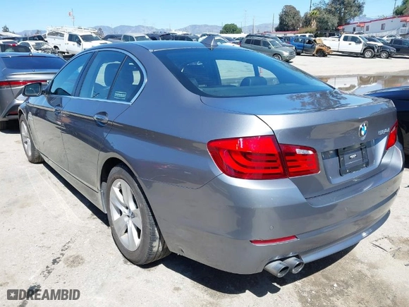 2012 BMW 5 Series 528i with VIN WBAXG5C53CDX03133, listed as a IAAI auction lot 41643009 with 105,360 mi miles. Bid and sale history available at carsss.com. Image 3.