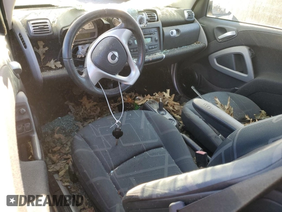 2010 Smart fortwo Pure с VIN WMEEJ3BA4AK363015, выставлен на аукционе Copart как лот 76066204 с пробегом Не указан миль и Списание • Salvage title. История ставок и продаж доступна на DreamBid. Изображение 8.