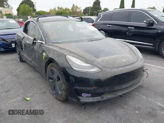 2019 Tesla Model 3 Mid Range with VIN 5YJ3E1EA2KF362048, listed as a IAAI auction lot 40141734 with 70,321 mi miles. Bid and sale history available at carsss.com. Image 1.