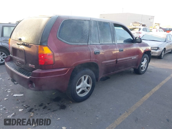 2005 GMC Envoy SLT with VIN 1GKDT13S452115924, listed as a IAAI auction lot 41443704 with 215,402 mi miles. Bid and sale history available at carsss.com. Image 4.