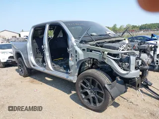 2022 Ram 1500 Laramie with VIN 1C6SRFJTXNN371176, listed as a IAAI auction lot 40344119 with Not provided miles and . Bid and sale history available at DreamBid. Image 1.