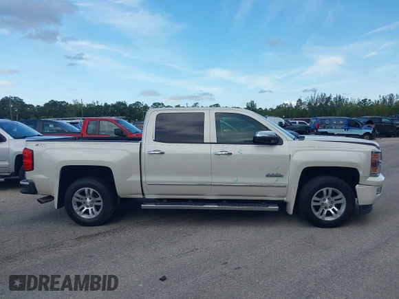 2014 Chevrolet Silverado 1500 High Country with VIN 3GCUKTEC4EG401571, listed as a IAAI auction lot 41984349 with 104,221 mi miles and . Bid and sale history available at DreamBid. Image 13.
