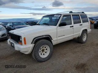 2001 Jeep Cherokee Sport z VIN 1J4FF58S41L540571, wystawiony jako Copart lot #79618964 z przebiegiem 246 098 mil mil oraz Czysty tytuł • Clean title. Historia ofert i sprzedaży dostępna na DreamBid. Obrazek 1.