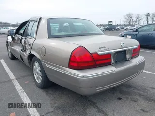 2003 Mercury Grand Marquis LS Premium z VIN 2MEFM75W73X653224, wystawiony jako IAAI lot #42038256 z przebiegiem 145 374 mil mil oraz . Historia ofert i sprzedaży dostępna na DreamBid. Obrazek 3.