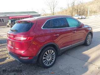 2015 Lincoln MKC with VIN 5LMTJ2AH0FUJ03004, listed as a IAAI auction lot 41997706 with 187,671 mi miles. Bid and sale history available at carsss.com. Image 4.