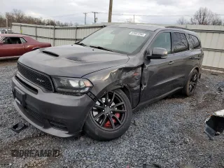 2018 Dodge Durango SRT with VIN 1C4SDJGJ1JC201813, listed as a Copart auction lot 87067294 with 76,248 mi miles and Salvage Title. Bid and sale history available at DreamBid. Image 1.