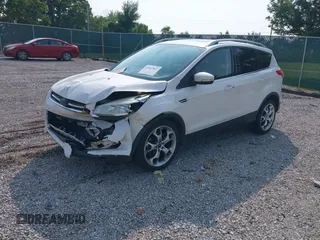 2015 Ford Escape Titanium with VIN 1FMCU0JXXFUA07175, listed as a IAAI auction lot 42447067 with 94,893 mi miles and . Bid and sale history available at DreamBid. Image 2.