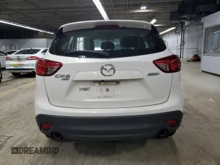 2016 Mazda CX-5 Sport with VIN JM3KE4BY9G0694709, listed as a Copart auction lot 55147555 with 98,900 mi miles and Salvage title. Bid and sale history available at DreamBid. Image 6.