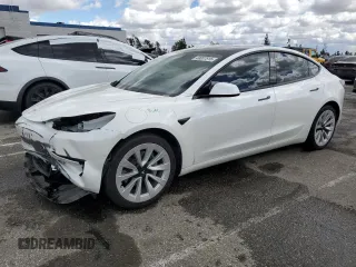 2022 Tesla Model 3 Long Range with VIN 5YJ3E1EB4NF129995, listed as a Copart auction lot 49007815 with 50,056 mi miles and Salvage Title. Bid and sale history available at DreamBid. Image 1.