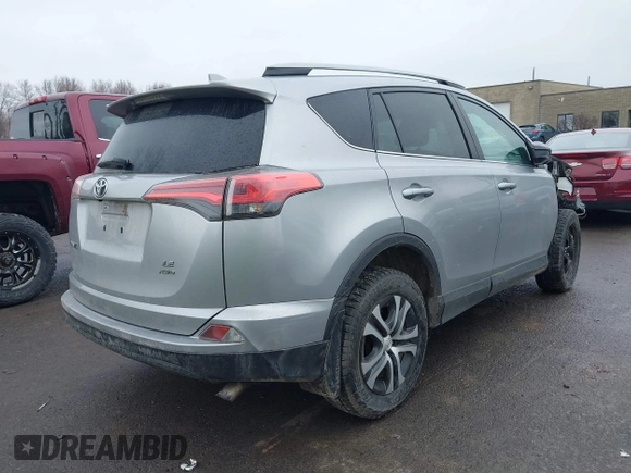 2018 Toyota RAV4 LE with VIN 2T3BFREVXJW717079, listed as a IAAI auction lot 42001580 with 96,044 mi miles. Bid and sale history available at carsss.com. Image 4.