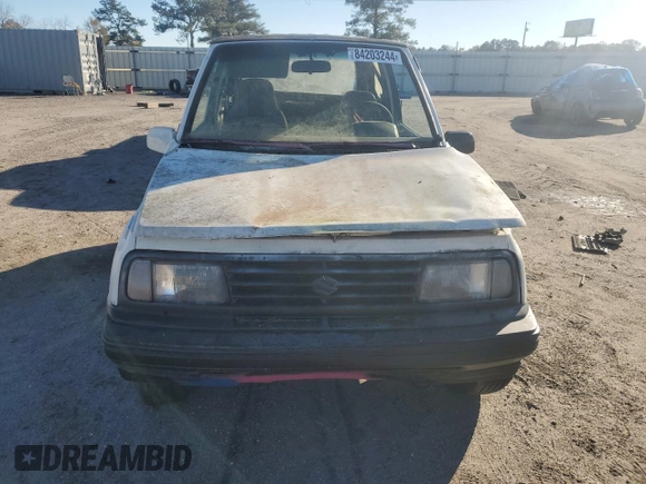 1990 Geo Tracker z VIN 2CNBJ18UXL6217744, wystawiony jako Copart lot #84203244 z przebiegiem 23 221 mil mil oraz Szkody całkowita. Historia ofert i sprzedaży dostępna na DreamBid. Obrazek 5.