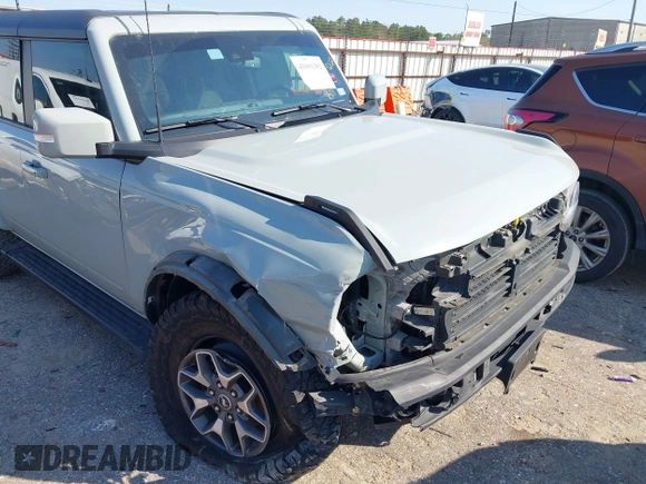 2023 Ford Bronco z VIN 1FMDE5BH5PLB37801, wystawiony jako IAAI lot #41691282 z przebiegiem 21 129 mil mil oraz . Historia ofert i sprzedaży dostępna na DreamBid. Obrazek 6.