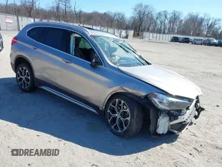 2021 BMW X1 xDrive28i with VIN WBXJG9C06M5S85511, listed as a IAAI auction lot 41705422 with 30,636 mi miles. Bid and sale history available at carsss.com. Image 1.