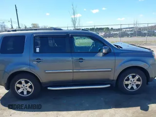 2011 Honda Pilot Touring with VIN 5FNYF4H95BB090892, listed as a IAAI auction lot 41878404 with 131,757 mi miles. Bid and sale history available at carsss.com. Image 13.