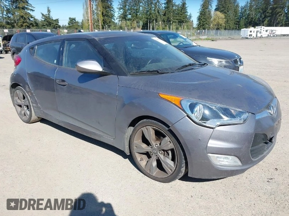 2013 Hyundai Veloster w/Black Int with VIN KMHTC6AD8DU103122, listed as a IAAI auction lot 42068175 with 123,512 mi miles and . Bid and sale history available at DreamBid. Image 1.