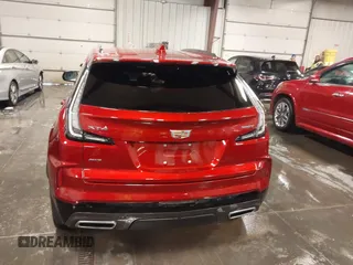 2024 Cadillac XT4 AWD Sport z VIN 1GYFZFR42RF154352, wystawiony jako IAAI lot #41249916 z przebiegiem 27 378 mil mil oraz . Historia ofert i sprzedaży dostępna na DreamBid. Obrazek 16.