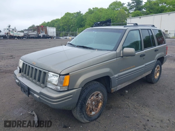 1998 Jeep Grand Cherokee Limited z VIN 1J4GZ78Y5WC261391, wystawiony jako IAAI lot #42275913 z przebiegiem 180 552 mil mil oraz . Historia ofert i sprzedaży dostępna na DreamBid. Obrazek 2.