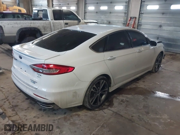2019 Ford Fusion Titanium with VIN 3FA6P0D92KR153096, listed as a IAAI auction lot 41679393 with 127,292 mi miles and . Bid and sale history available at DreamBid. Image 4.