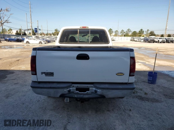 2001 Ford Super Duty F-250 XL with VIN 1FTNW20F61EB42376, listed as a Copart auction lot 74001054 with 215,944 mi miles and Salvage Title. Bid and sale history available at carsss.com. Image 6.