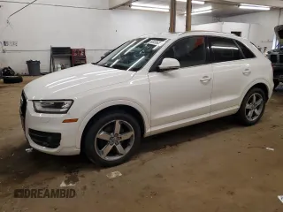 2015 Audi Q3 Premium Plus z VIN WA1EFCFS9FR006974, wystawiony jako Copart lot #60036635 z przebiegiem 117 961 mil mil oraz Czysty tytuł • Clean title. Historia ofert i sprzedaży dostępna na DreamBid. Obrazek 1.