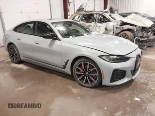 2024 BMW i4 M50 with VIN WBY33AW04RFS33762, listed as a IAAI auction lot 41563584 with 4,419 mi miles. Bid and sale history available at carsss.com. Image 1.