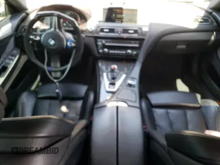 2015 BMW M6 z VIN WBS6C9C50FD467538, wystawiony jako Copart lot #52152245 z przebiegiem 65 483 mil mil oraz Czysty tytuł • Clean title. Historia ofert i sprzedaży dostępna na DreamBid. Obrazek 8.