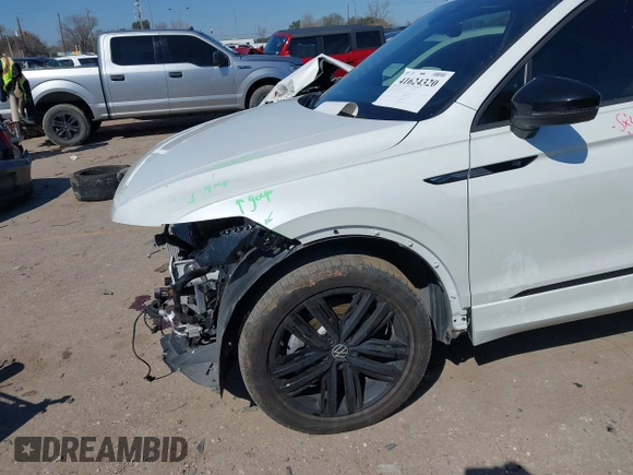 2022 Volkswagen Tiguan SE R-Line Black with VIN 3VVCB7AX4NM165115, listed as a IAAI auction lot 41624320 with 18,074 mi miles and . Bid and sale history available at DreamBid. Image 6.
