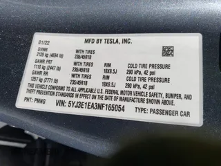 2022 Tesla Model 3 with VIN 5YJ3E1EA3NF165054, listed as a IAAI auction lot 41805729 with 225,773 mi miles. Bid and sale history available at carsss.com. Image 9.
