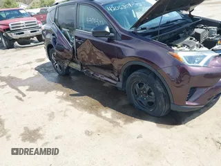 2016 Toyota RAV4 LE with VIN 2T3ZFREV8GW310580, listed as a IAAI auction lot 42063071 with 104,099 mi miles and . Bid and sale history available at DreamBid. Image 6.