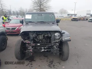 2021 Jeep Wrangler Unlimited Sahara z VIN 1C4JJXP68MW745098, wystawiony jako IAAI lot #41461092 z przebiegiem 36 410 mil mil oraz . Historia ofert i sprzedaży dostępna na DreamBid. Obrazek 13.