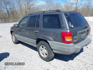 2002 Jeep Grand Cherokee z VIN 1J4GX38S92C149908, wystawiony jako IAAI lot #41782530 z przebiegiem 145 195 mil mil oraz . Historia ofert i sprzedaży dostępna na DreamBid. Obrazek 3.