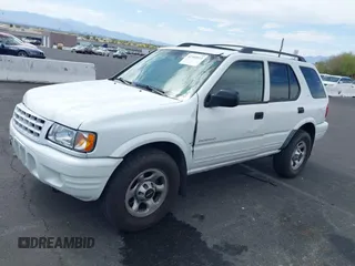 2001 Isuzu Rodeo S z VIN 4S2CK58W614329085, wystawiony jako IAAI lot #42303013 z przebiegiem 171 933 mil mil oraz . Historia ofert i sprzedaży dostępna na DreamBid. Obrazek 6.