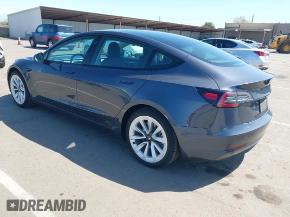 2022 Tesla Model 3 with VIN 5YJ3E1EA6NF144098, listed as a IAAI auction lot 41965360 with 75,597 mi miles. Bid and sale history available at carsss.com. Image 3.