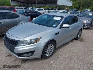 2012 Kia Optima LX with VIN 5XXGM4A77CG074198, listed as a IAAI auction lot 41927738 with 163,697 mi miles. Bid and sale history available at carsss.com. Image 2.