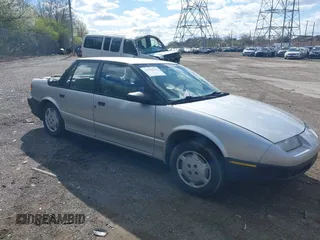 1992 Saturn SL z VIN 1G8ZG5491NZ263345, wystawiony jako IAAI lot #41982914 z przebiegiem 116 545 mil mil oraz . Historia ofert i sprzedaży dostępna na DreamBid. Obrazek 1.