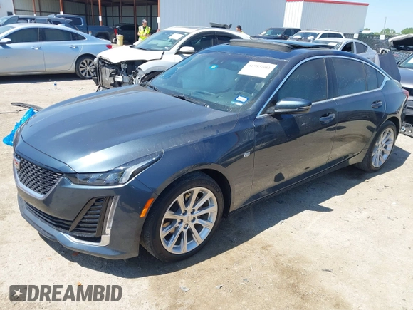 2021 Cadillac CT5 Luxury z VIN 1G6DW5RKXM0144424, wystawiony jako IAAI lot #41985803 z przebiegiem 65 555 mil mil oraz . Historia ofert i sprzedaży dostępna na DreamBid. Obrazek 2.