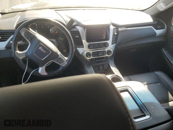 2015 GMC Yukon SLT with VIN 1GKS1BKC0FR239629, listed as a Copart auction lot 77414814 with 171,611 mi miles and Salvage Title. Bid and sale history available at carsss.com. Image 8.