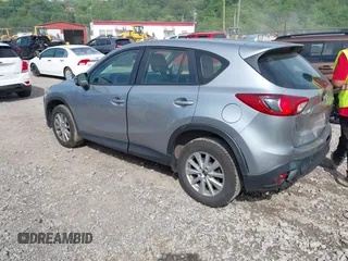 2014 Mazda CX-5 Sport with VIN JM3KE2BE9E0423737, listed as a IAAI auction lot 42222646 with 116,160 mi miles and . Bid and sale history available at DreamBid. Image 3.