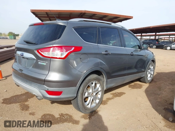2014 Ford Escape Titanium with VIN 1FMCU0JX5EUC00297, listed as a IAAI auction lot 41928316 with 146,406 mi miles. Bid and sale history available at carsss.com. Image 4.