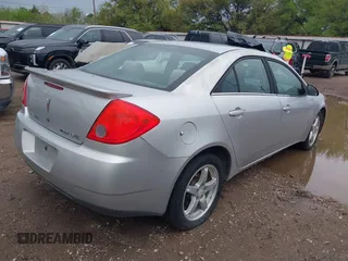 2009 Pontiac G6 1SB with VIN 1G2ZJ57K094243360, listed as a IAAI auction lot 41904278 with 144,346 mi miles and . Bid and sale history available at DreamBid. Image 4.